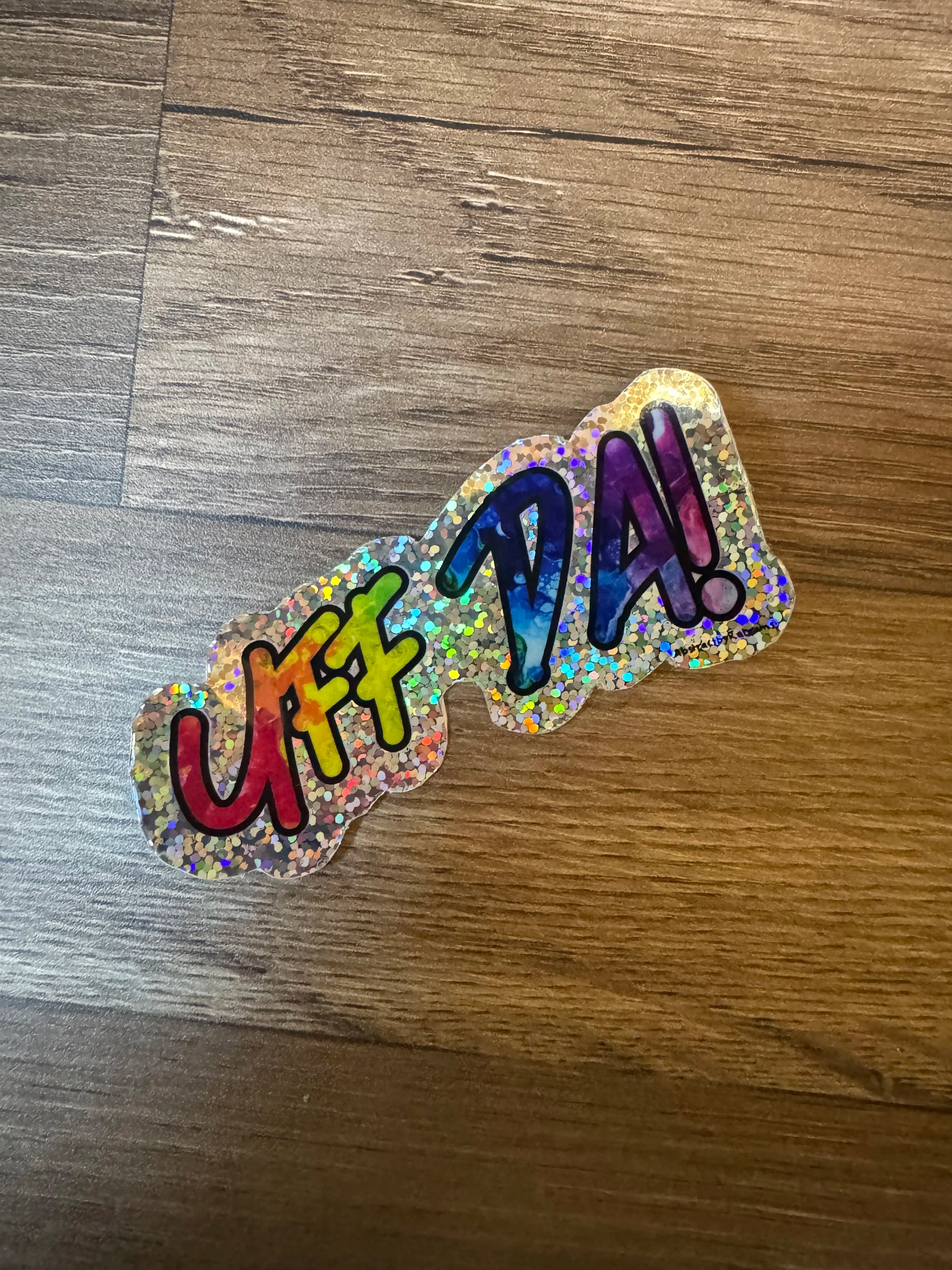 B-Grade Rainbow Glittery Uff Da Glossy Sticker